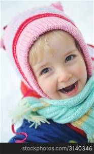 Happy little girl in winter portrait