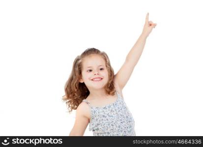 Happy little girl indicating something with the finger isolated on a white background