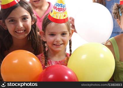 happy little girls at birthday party