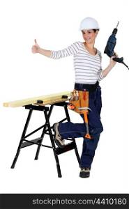 happy-looking female carpenter thumb up