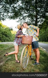 Happy love couple on picnic in summer field. Romantic junket of man and woman