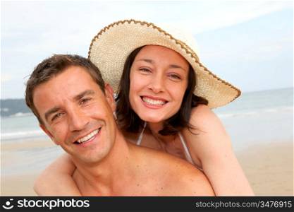 Happy loving couple at the beach