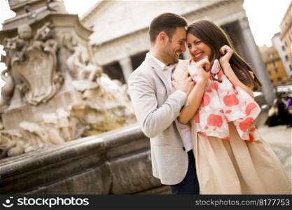 Happy loving couple, man and woman traveling on holidays in Rome, Italy