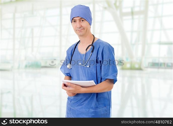 Happy male doctor at the hospital
