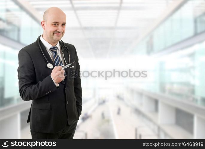 happy male doctor, at the hospital