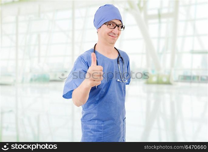 Happy male doctor showing thumbs up, at the hospital. doctor