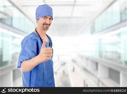 Happy male doctor showing thumbs up, at the hospital. doctor