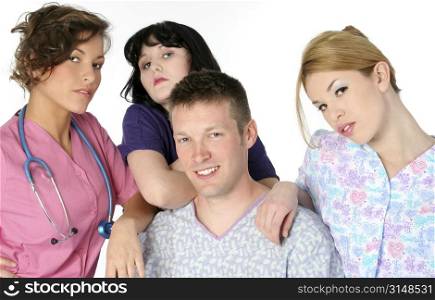 Happy male patient with his three beautiful young nurses.