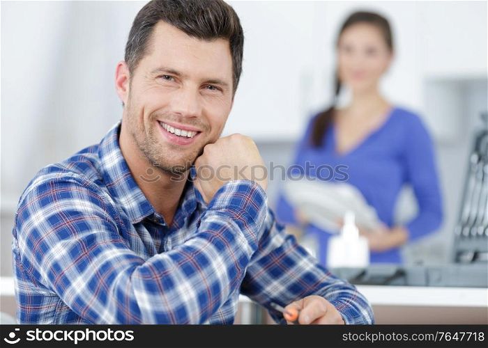 happy male worker looking at camera