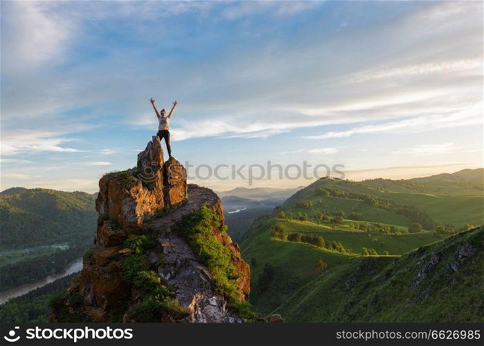 Happy man and woman on top mountain in Altai, sunset light, beauty summer landcape. Happy woman on top mountain