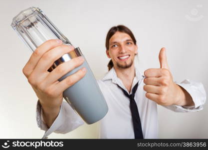 Happy man bartender with shaker making alcohol cocktail drink thumb up gesture studio shot on gray