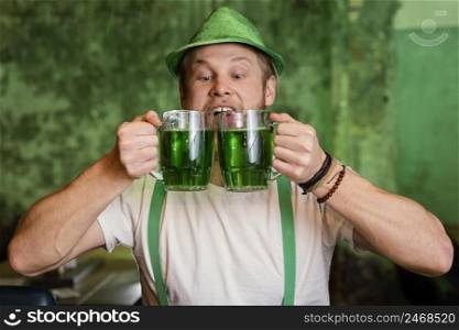 happy man celebrating st patrick s day bar with drinks