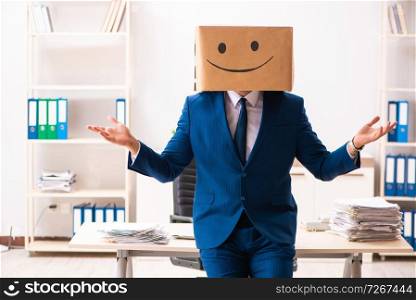 Happy man employee with box instead of his head