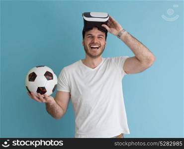 Happy man getting experience using VR headset glasses of virtual reality, isolated on blue background