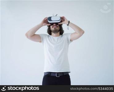 Happy man getting experience using VR headset glasses of virtual reality, isolated on white background