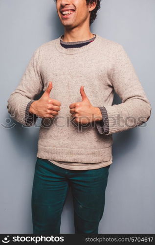 Happy man giving thumbs up