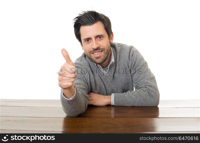happy man going thumb up, on a desk, isolated. happy man