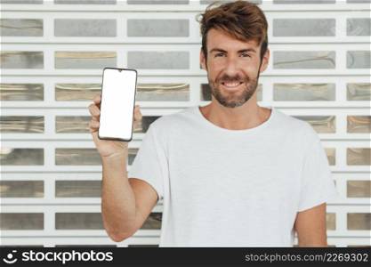 happy man holding cellphone with mock up