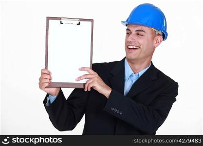 Happy man holding clip-board