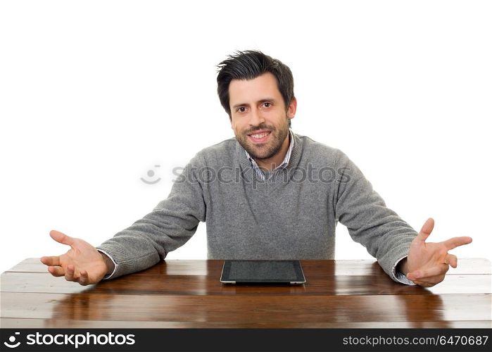 happy man on a desk with a tablet pc, isolated. happy man