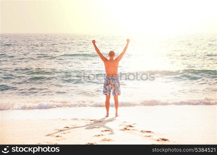 Happy man on beach