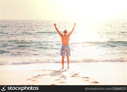 Happy man on beach