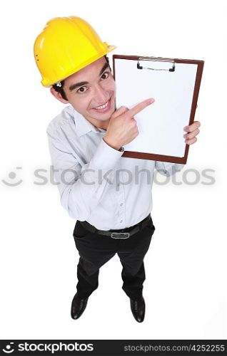 Happy man pointing at clip board