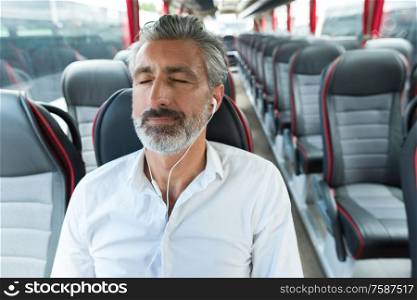 happy man sleeping in travel bus