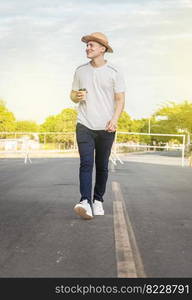 Happy man walking with glass of coffee, happy young man walking with glass of coffee