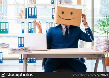 Happy man with box instead of his head. The happy man with box instead of his head