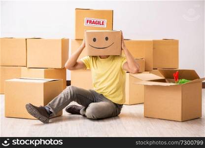 Happy man with box instead of his head 