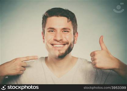 Happy man with half shaved face beard hair.. Portrait of happy man with half shaved face beard hair. Smiling handsome guy on blue showing thumb up gesture. Skin care and hygiene. Instagram filter.