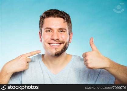 Happy man with half shaved face beard hair.. Portrait of happy man with half shaved face beard hair. Smiling handsome guy on blue showing thumb up gesture. Skin care and hygiene.