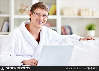 Happy man with laptop