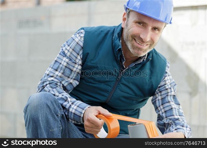 happy man with tape measure