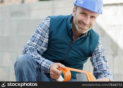 happy man with tape measure