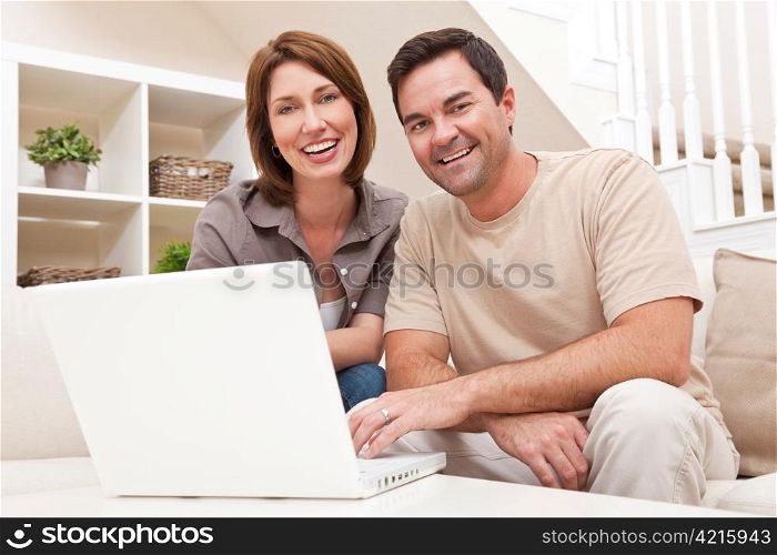 Happy Man Woman Couple Using Laptop Computer At Home