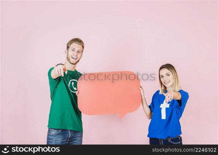 happy man woman gesturing while holding empty orange speech bubble