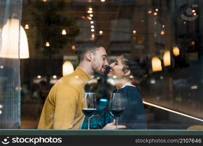 happy man woman near glasses wine restaurant
