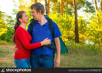 happy married couple on vacation in camping