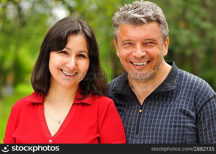 Happy mature couple outdoors portrait