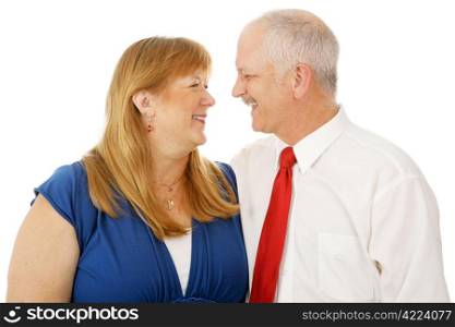 Happy mature married couple who are still best friends. Isolated on white.