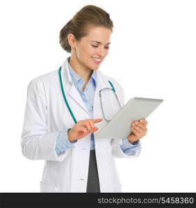 Happy medical doctor woman using tablet PC