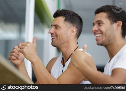 happy men in the gym