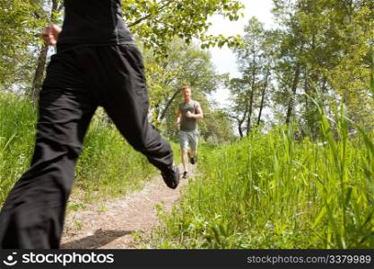 Happy men jogging at the park with his friend