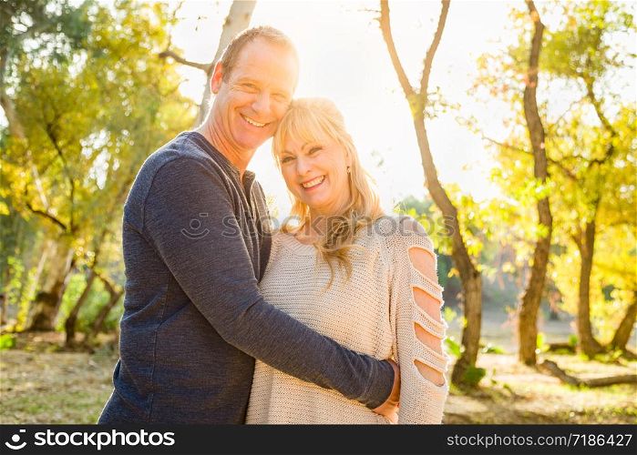 Happy Middle Aged Caucasian Couple Portrait Outdoors.