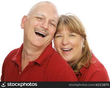 Happy middle aged couple laughing together. Isolated on white.
