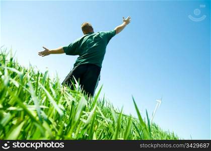 Happy middle-aged man on the summer field