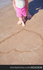 happy mom and baby on beach have fun while learning to walk and make first steps