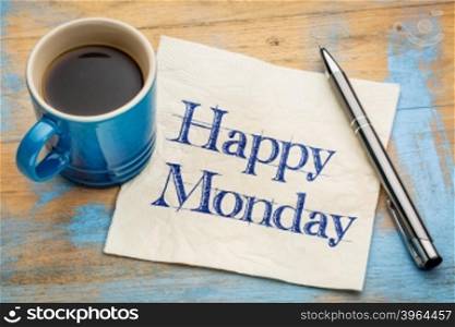 Happy Monday - cheerful handwriting on a napkin with a cup of coffee